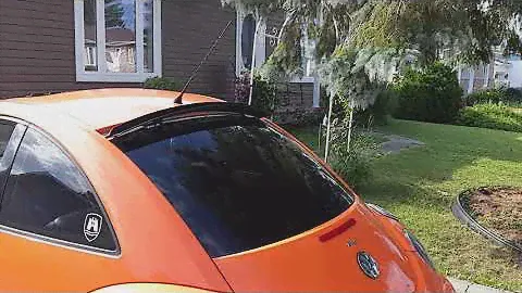 New beetle hidden roof spoiler