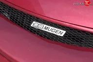 Эмблема (шильдик) решетки радиатора Mugen Volkswagen Passat B7 универсал (2010-2015)