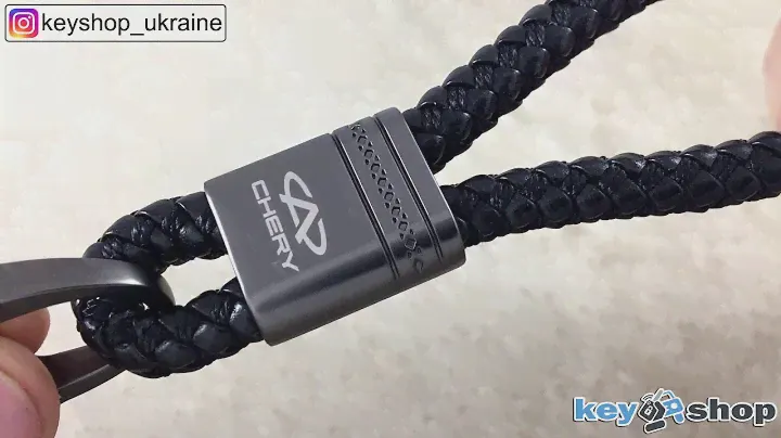 Кожаный плетеный брелок с темным хромом, лого Chery
